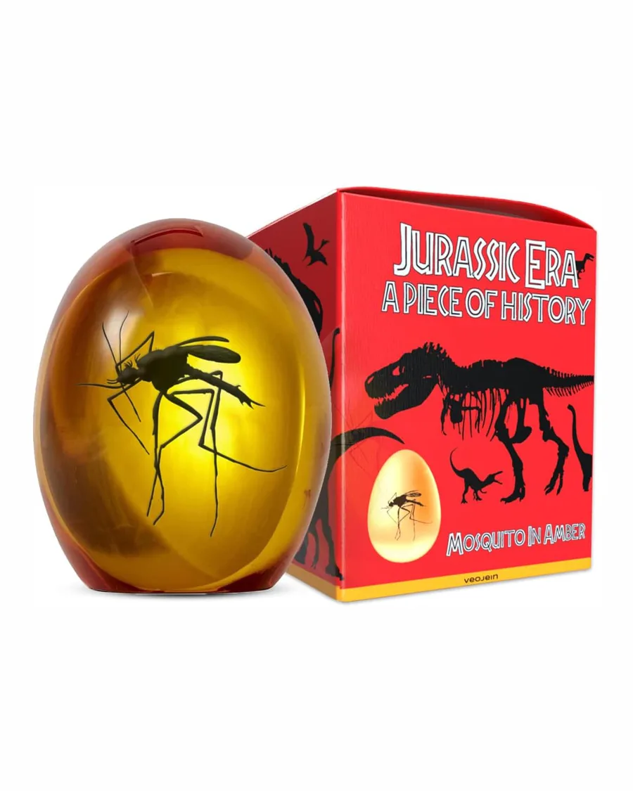 Mosquito encased in amber-colored resin, flat bottom, approx 3 inches, detailed 3D shape with 2D UV printed foliage backdrop.