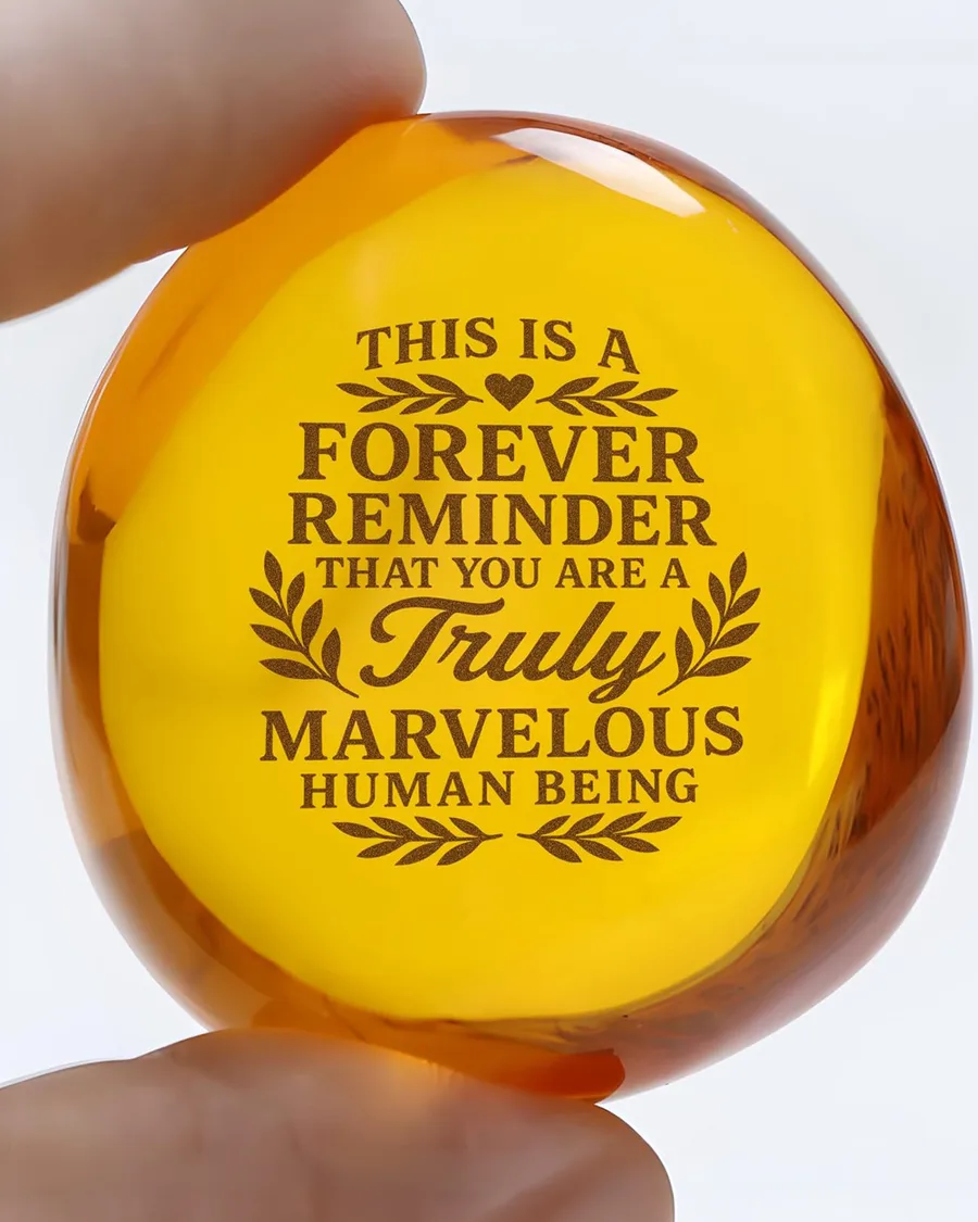 Amber resin keepsake stone, oval shape, translucent golden hue, approx 3 inches, inscribed uplifting quote for encouragement.