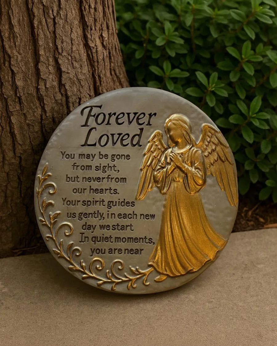 Round, 9.45-inch gray stepping stone featuring a carved angel design, crafted from weather-resistant material for outdoor use.